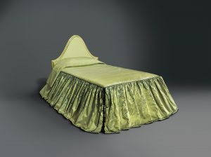 A bed with a curved, upholstered, green headboard and matching green bedcover with trailing floral decorations on its skirt and black corseting at its corners.