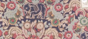 Textile design sample featuring vegetal motifs drawn with thick lines in beige, pink, blue, and green with an elephant in dark blue.