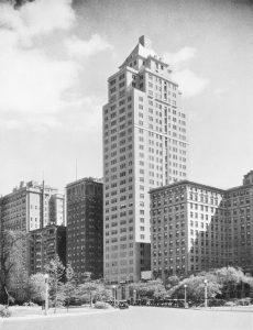 Black and white photograph of Drake Tower, looking up from street-level.