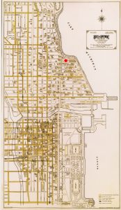 1928 map of central Chicago showing prominent buildings in the city, including the Drake Tower, Drake Hotel, and Chicago’s business district. A large red star indicates the location of the Drake Tower in the North East section.